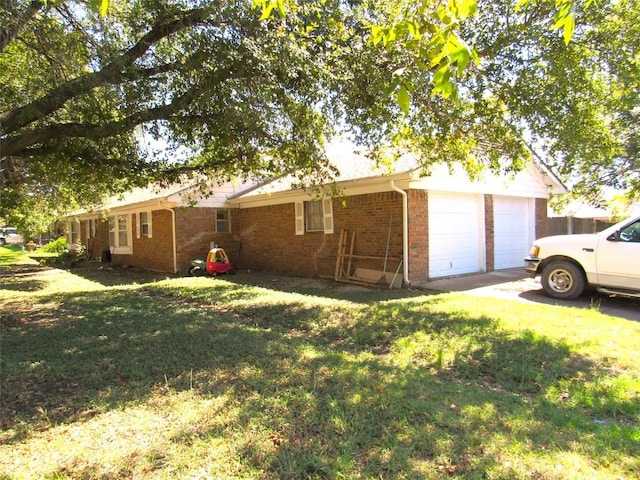 view of side of property with a garage and a yard