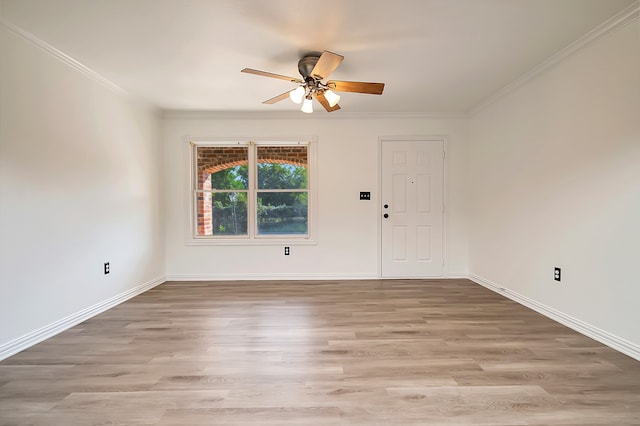 unfurnished room with crown molding, light hardwood / wood-style floors, and ceiling fan