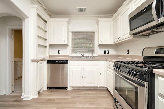 kitchen with white cabinets, stainless steel appliances, and sink