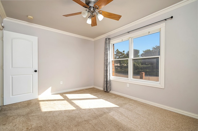 empty room with crown molding, ceiling fan, and light carpet