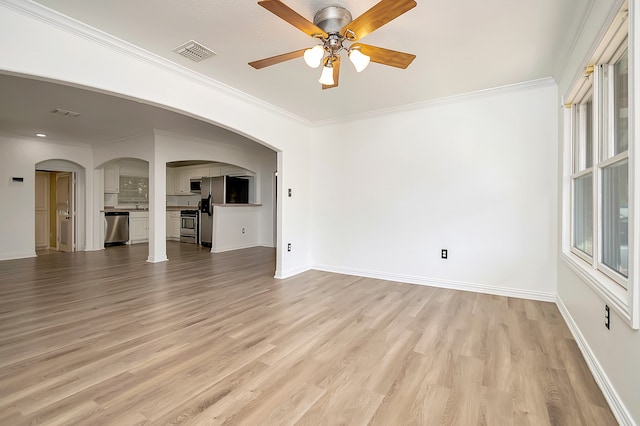 unfurnished living room with ceiling fan, ornamental molding, and light hardwood / wood-style floors