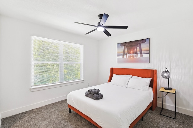 bedroom featuring ceiling fan and carpet