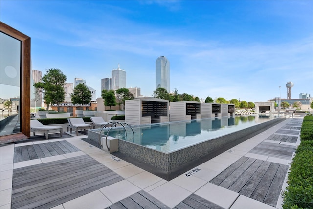 view of pool with a water view