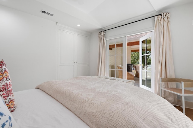 bedroom featuring access to outside and hardwood / wood-style flooring