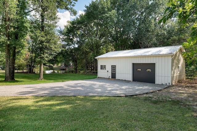 garage featuring a yard