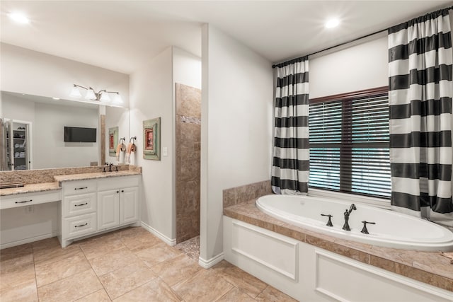 bathroom with shower with separate bathtub, vanity, and tile patterned floors