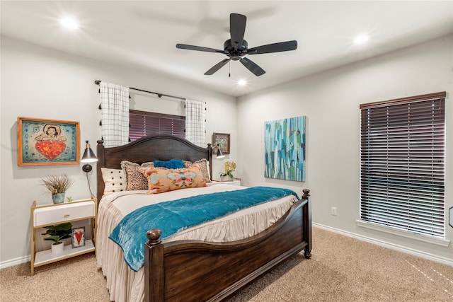 bedroom featuring ceiling fan and light colored carpet