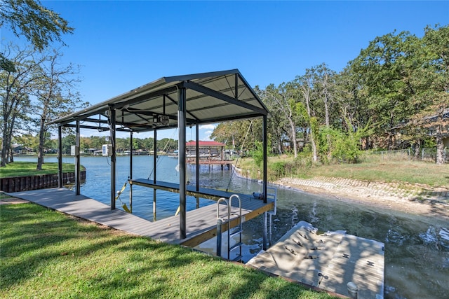 view of dock featuring a lawn and a water view