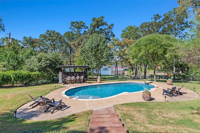 view of swimming pool with a patio and a lawn