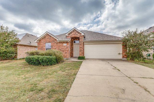 ranch-style house featuring a garage and a front yard