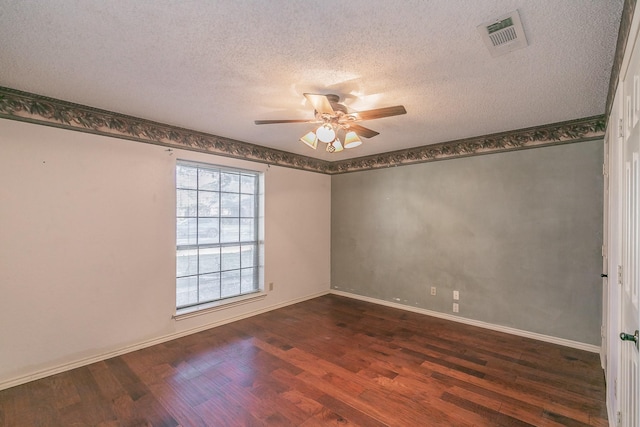 unfurnished room with dark hardwood / wood-style flooring, ceiling fan, and a textured ceiling