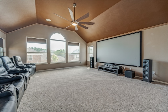 carpeted home theater featuring ceiling fan and lofted ceiling