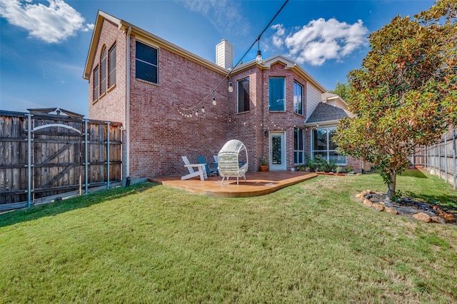 back of property featuring a yard and a patio area