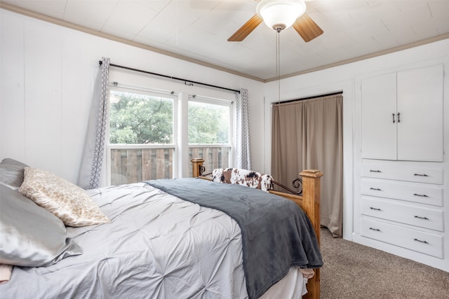 carpeted bedroom with ceiling fan and crown molding