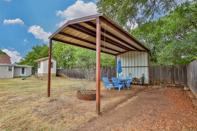 view of yard featuring a shed and a patio