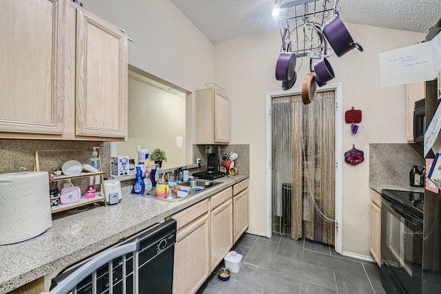 kitchen featuring black appliances and light brown cabinets