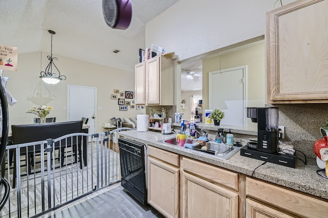 kitchen featuring dishwasher, a textured ceiling, sink, lofted ceiling, and light brown cabinets