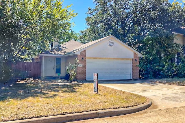 single story home with a front yard and a garage