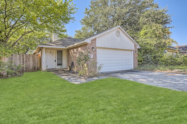 single story home with a garage and a front yard