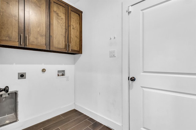 washroom featuring hookup for a gas dryer, hookup for a washing machine, cabinets, and hookup for an electric dryer