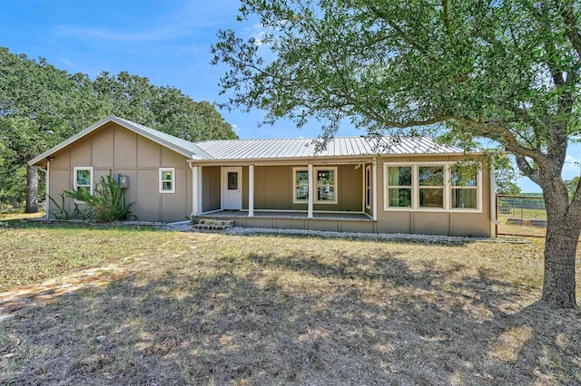 ranch-style home with covered porch