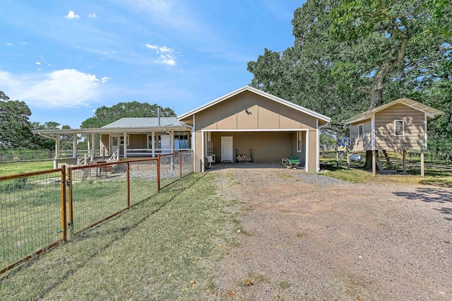 view of front of property featuring an outdoor structure