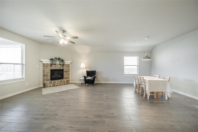 unfurnished living room featuring dark hardwood / wood-style floors and ceiling fan