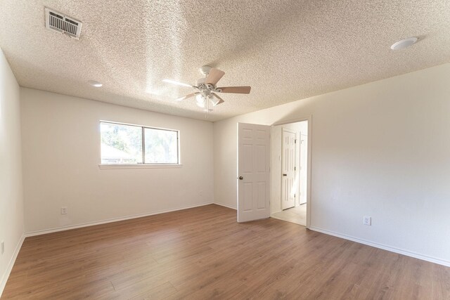 hall with a textured ceiling