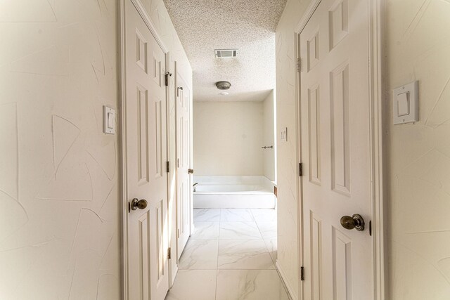 bathroom featuring vanity and a textured ceiling