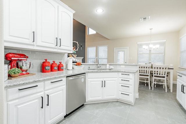 kitchen featuring white cabinets, kitchen peninsula, dishwasher, sink, and a chandelier