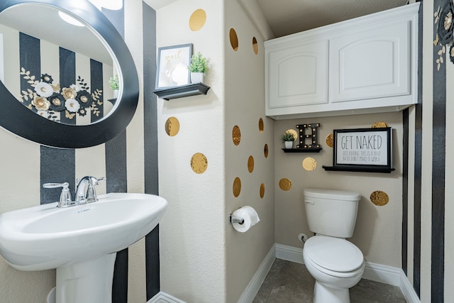 bathroom with toilet and sink