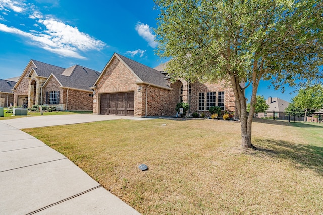 view of front facade featuring a front lawn and a garage