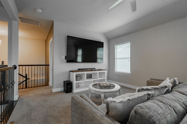 carpeted living room featuring vaulted ceiling