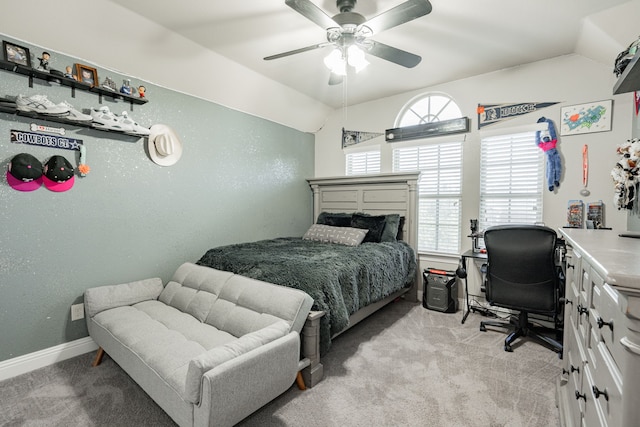 carpeted bedroom featuring ceiling fan and lofted ceiling