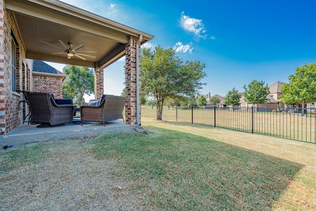 view of yard with a patio and ceiling fan