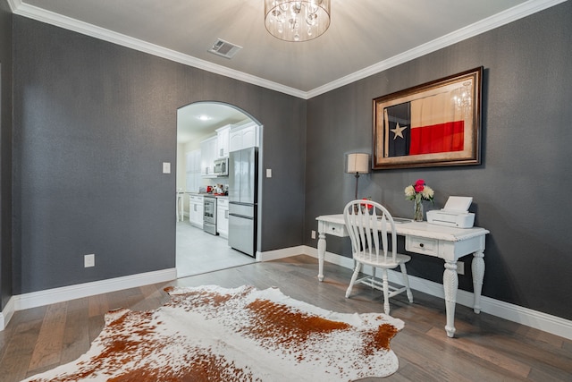 office space featuring ornamental molding, an inviting chandelier, and hardwood / wood-style floors