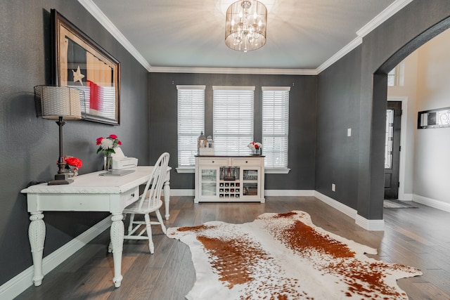 home office featuring crown molding, dark wood-type flooring, and a notable chandelier