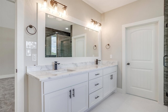 bathroom with vanity and an enclosed shower