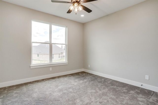 spare room featuring carpet flooring and ceiling fan