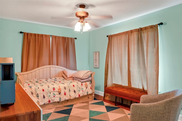 bedroom featuring wood-type flooring and ceiling fan