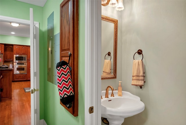13823 Llano Dr, Weatherford, TX 76087 - bathroom with a sink and wood finished floors