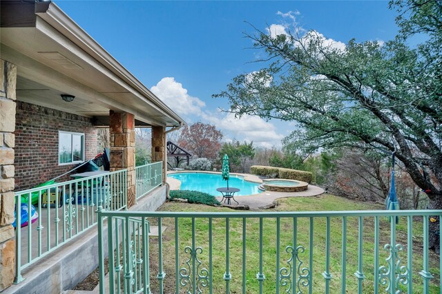 13823 Llano Dr, Weatherford, TX 76087 - view of pool featuring a yard and a pool with connected hot tub