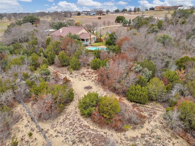 birds eye view of property with a rural view