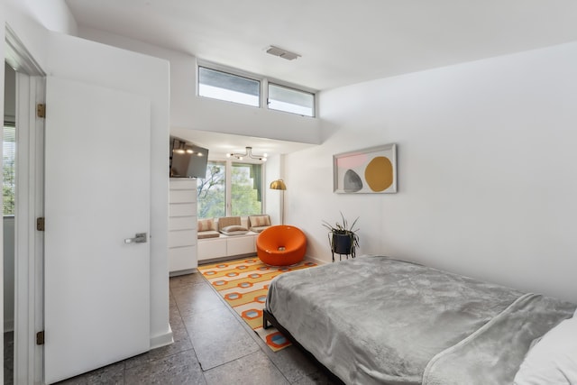 bedroom featuring visible vents