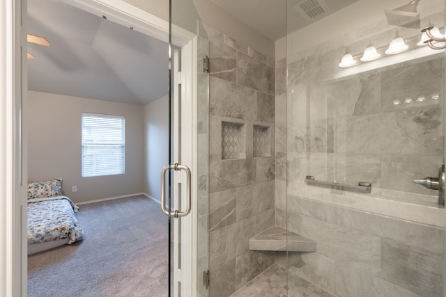 bathroom featuring lofted ceiling and a shower with door