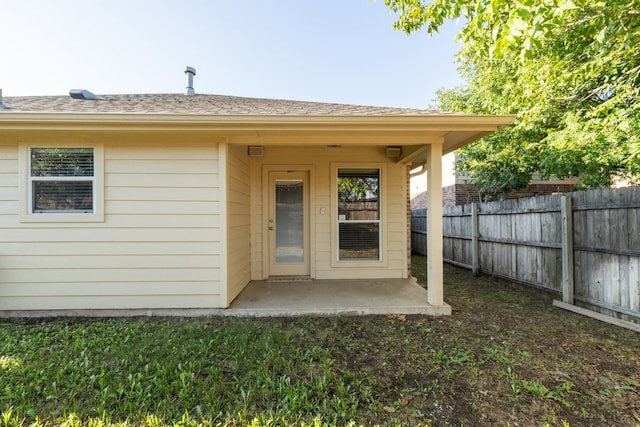 property entrance featuring a patio area