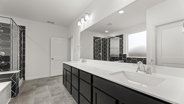 full bath with double vanity, a stall shower, visible vents, and a sink