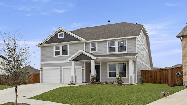 view of front of home featuring an attached garage, concrete driveway, a front yard, and fence