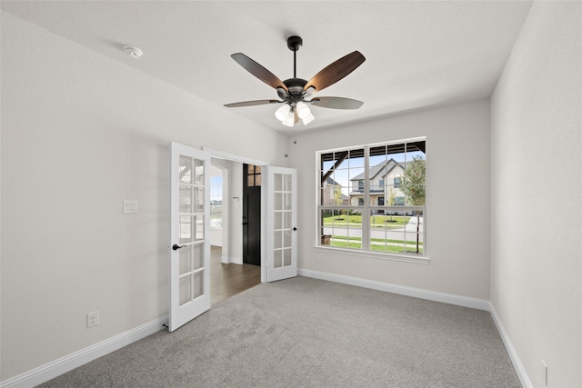 unfurnished bedroom featuring carpet, ceiling fan, and french doors