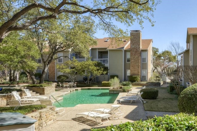 back of property with a patio